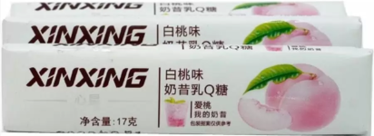 Карамель со вкусом персика Xinxing 30*17г оптом