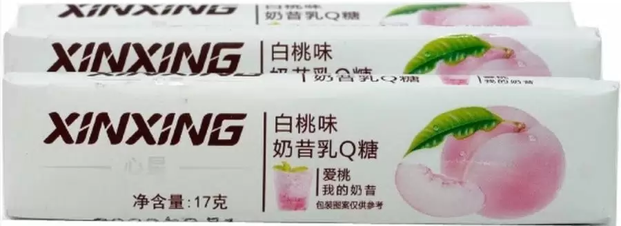 Карамель со вкусом персика Xinxing 30*17г оптом
